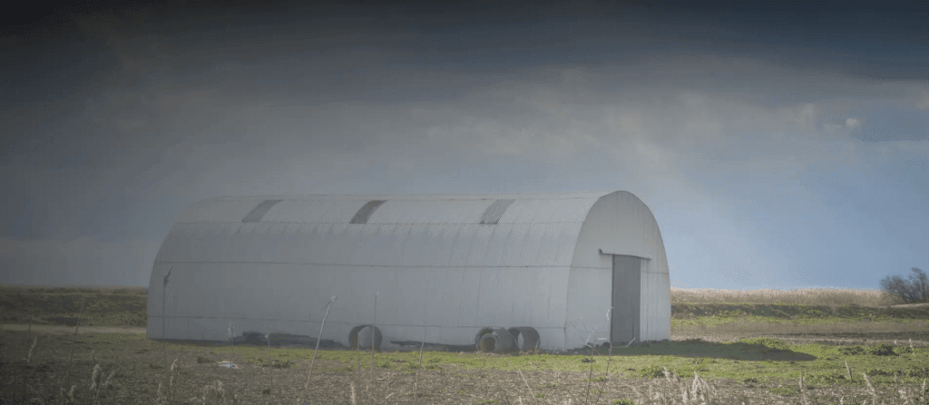 Quonset SteelMaster building on a field