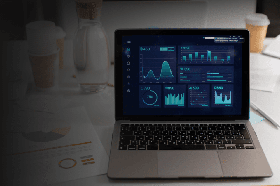 A unified dashboard on a laptop screen showing IT, IoT and OT functionalities
