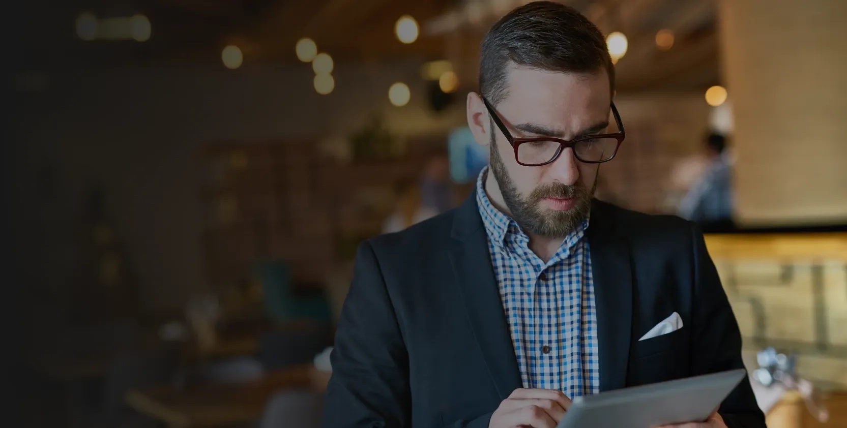 A manager using a digital tablet for building management system