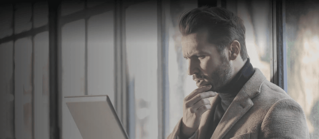 Man working on CMMS systems using a desktop