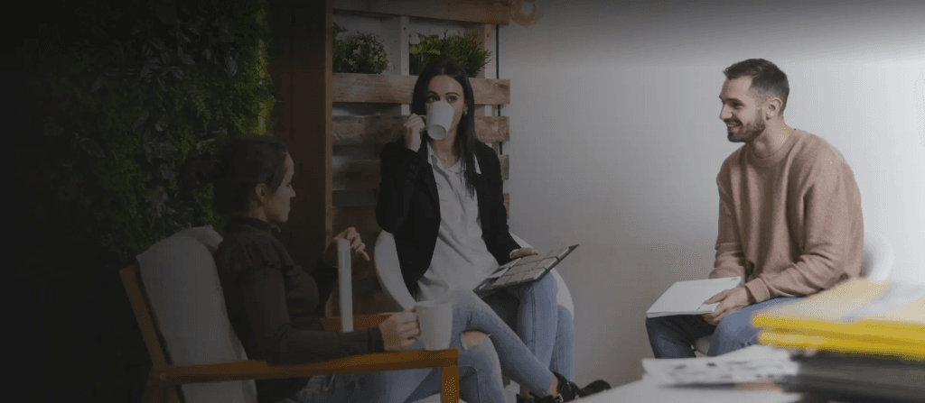 Colleagues on a break in sustainable workplaces