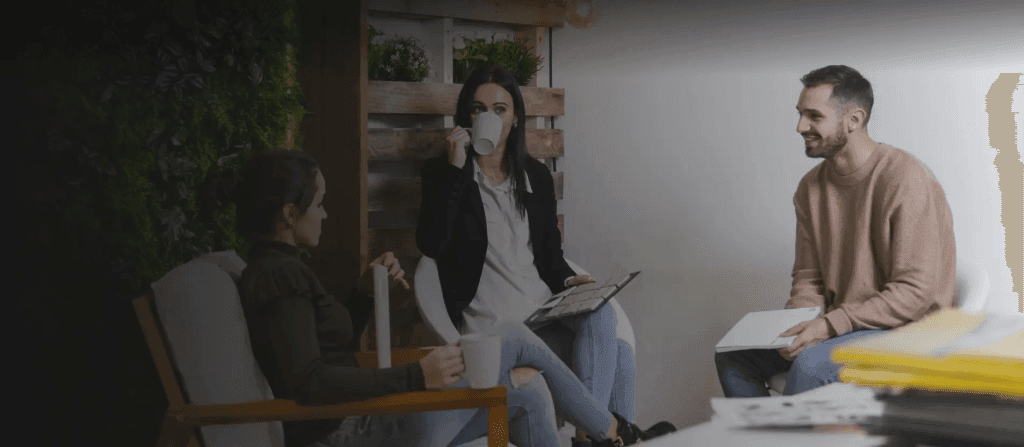 Colleagues on a break in sustainable workplaces