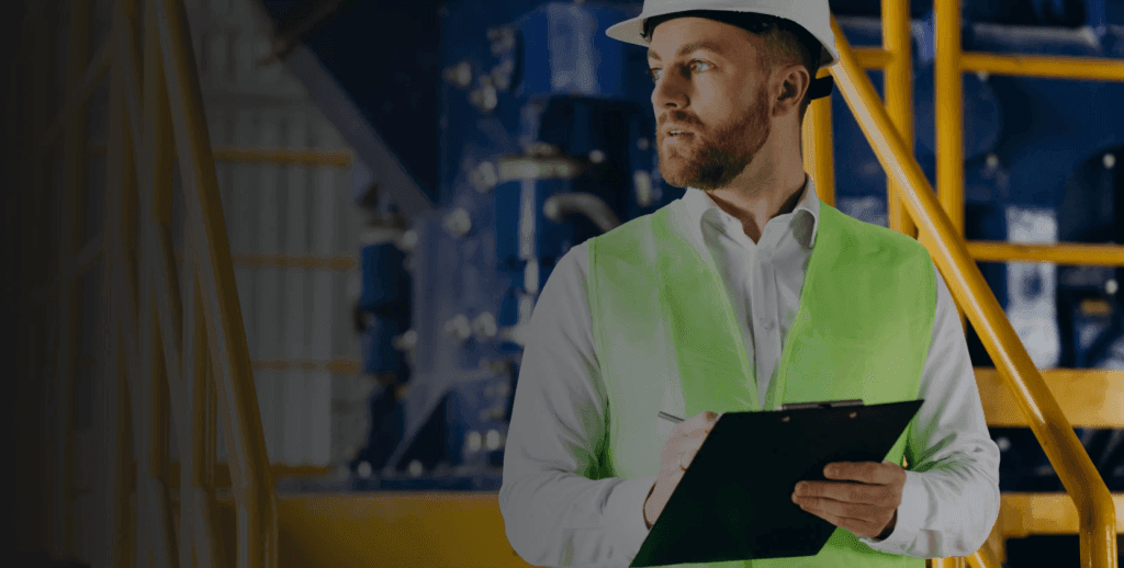 Facility manager taking notes before using predictive maintenance strategy.