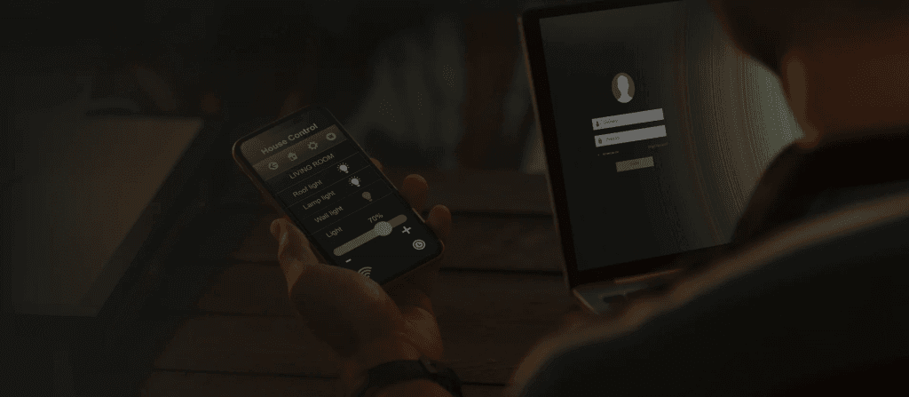 Man using mobile phone for remote asset monitoring for home.